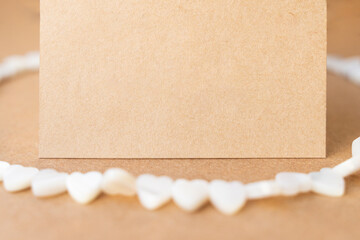Gemstone necklace made of mother of pearls in shape of hearts.
