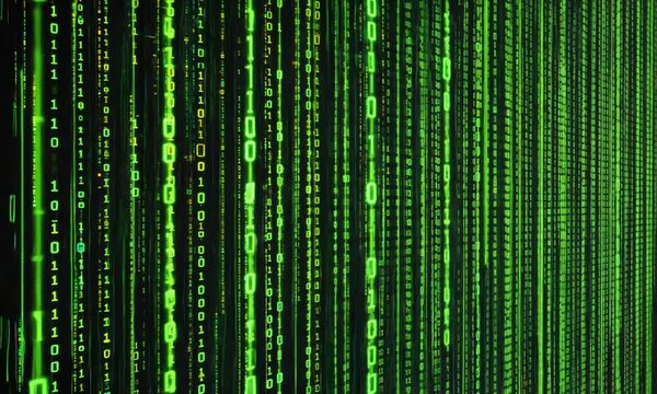 Glowing binary code falling on dark background