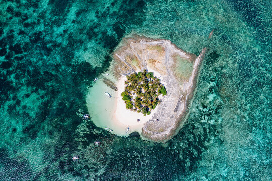 Drone view of tropical island and ocean, Guyam island, Siargao, Philippines