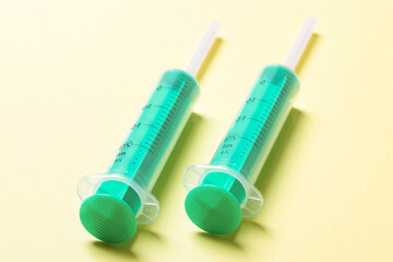 Top view of medical syringes on colorful background. Health care concept with copy space