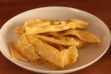 Fafda is a fried crispy crunchy tasty snack made with gram flour, laced with carom seeds and black pepper. It is a popular Gujarati vegan snack. Jalebi is one of the most popular desserts from india.