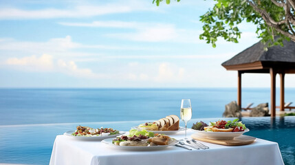 A table set up on a balcony overlooking the ocean. 
