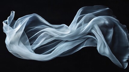 Fototapeta premium Flowing white fabric on black background.