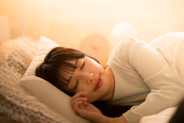 Woman falling asleep with indirect lighting Close-up of image of bed sleep and restful sleep