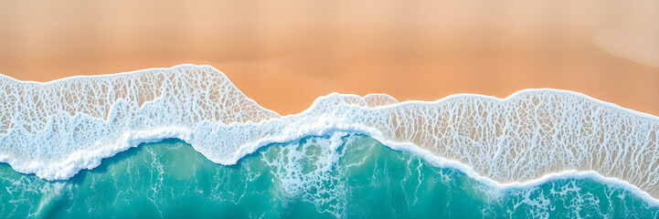 Summer seascape beautiful waves, blue sea water in sunny day. Top view shore drone. Sea coast aerial view, amazing tropical tranquil nature. Beautiful bright sea with waves splashing and beach sand