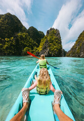 Family kayaking in Philippines, healthy lifestyle active summer vacations parents and child exploring Palawan lagoon tropical vibes