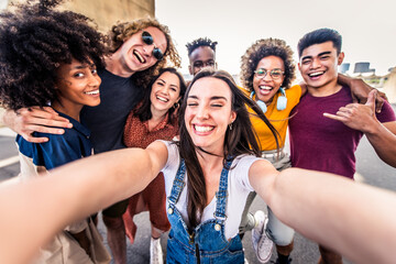 Happy diverse young people taking selfie photo with smart mobile phone outside - Cheerful friends...