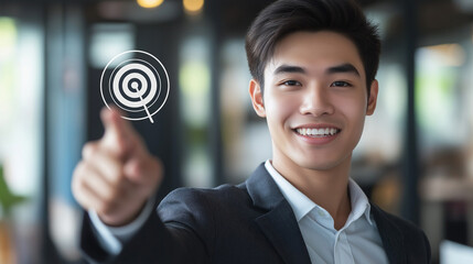 Business concept background. Executive young Asian businessman shows new year company goal with thumb. Company sales and company growth target. Employee's career target, skill development targets.
