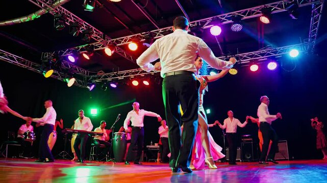 Dancing to lively music in a vibrant venue during a social dance event