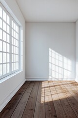 A white room with a brown wooden floor, white walls, and a window on the left side.