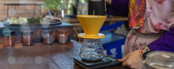 Process drip coffee, Barista start chose coffee bean and Roasting. Barista making drip coffee by pouring spills hot water on coffee ground with prepare filter from copper pot to glass transparent drip