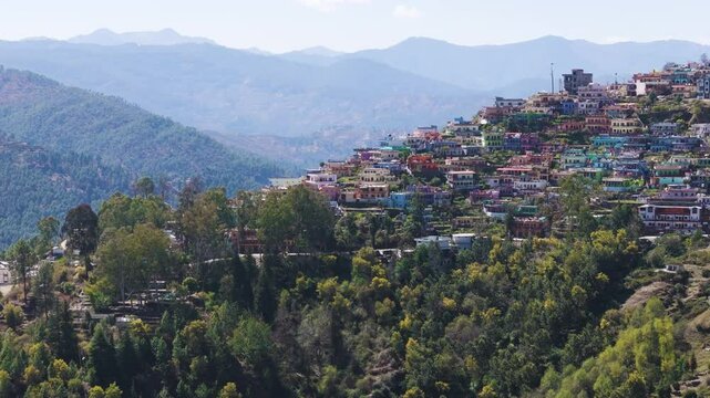 Aerial Drone shot of crowded city from top situated on top of the hill, almora uttarakhand