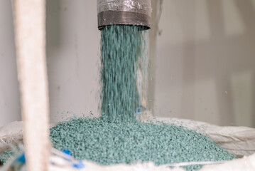 Modern production. plastic processing and production.round plastic granules move along the prod