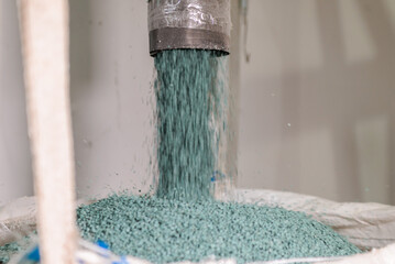 Modern production. plastic processing and production.round plastic granules move along the prod