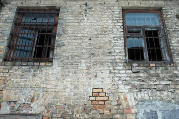 old abandoned brick building with broken windows