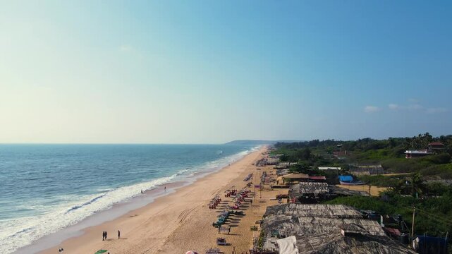 Aerial drone shot of baga beach in goa, empty and clean baga beach in goa 