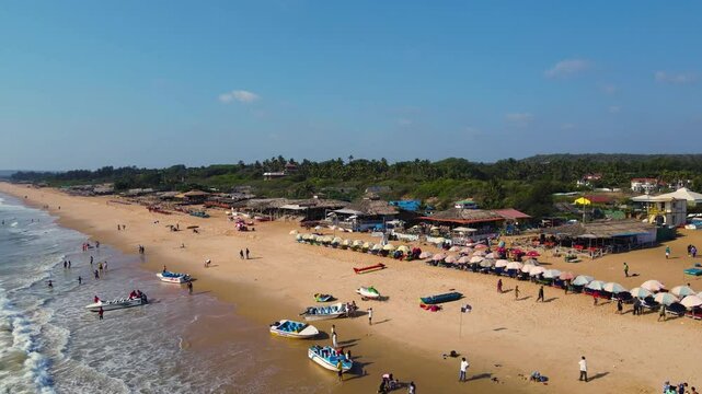 Aerial drone shot of shacks in baga beach in goa. 