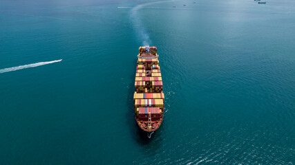 Industrial container tanker ship cruising in blue sea water