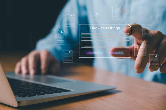 hand using laptop while choose to accept internet cookies policy or reject. Customer data privacy concept that allow web browser to collect user data to resell or use for marketing purpose.