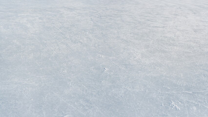 hockey puck and ice on the scratches surface abstract background ice arena