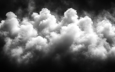 Obraz premium Dramatic monochrome cloudscape, dense, fluffy, white clouds against dark sky.