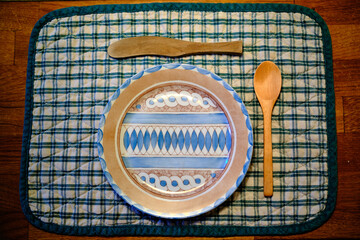 Elegant yet unusual breakfast plate and cutlery set, with olive wood cutlery and Persian design plate.