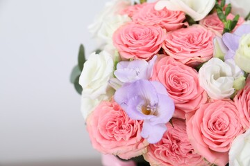 Beautiful wedding bouquet on light background, closeup. Space for text