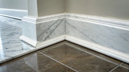 A closeup captures a corner of the room where the polished marble tiles meet the baseboard. The seamless transition highlights the precision of the installation while the shiny
