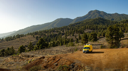 Fototapeta premium Camper van in the middle of the Canary pine forest in El Paso, La Palma