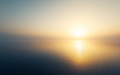 Obraz premium Serene sunrise over calm ocean.