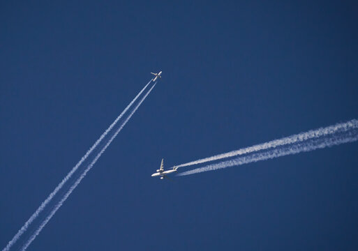 Airplanes passing each other in the sky