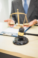 Male lawyer diligently examines documents placed on his desk, demonstrating his professionalism and dedication to finding legal truth, analyzing ideas, and pursuing justice with relentless focus.