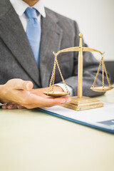 Male lawyer diligently examines documents placed on his desk, demonstrating his professionalism and dedication to finding legal truth, analyzing ideas, and pursuing justice with relentless focus.