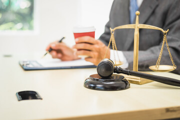 Male lawyer diligently examines documents placed on his desk, demonstrating his professionalism and dedication to finding legal truth, analyzing ideas, and pursuing justice with relentless focus.