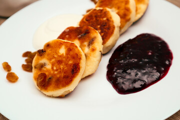 Classic homemade cheesecake with jam. Tasty homemade fried cheesecake. Dessert.