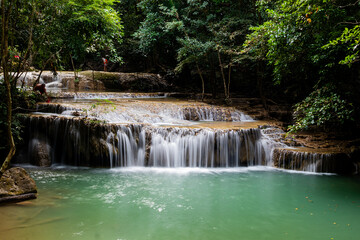 Beautiful and amazing Erawan waterfall in tropical forest of national park, Kanchanaburi, Thailand.