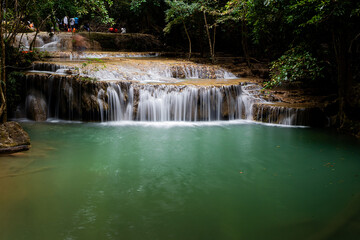 Obraz premium Beautiful and amazing Erawan waterfall in tropical forest of national park, Kanchanaburi, Thailand.