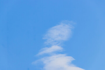 Sky is beautiful and clear with a few clouds. It is very bright and the sun is shining