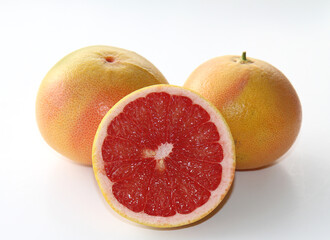 Two and Half Ripe Grapefruit isolated on white