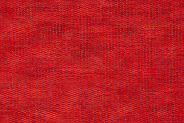 covering fabric with a natural texture. dark red background made of soft textile material. the...