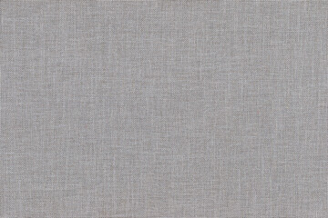 The texture of the grey fabric for textile upholstery. close up.