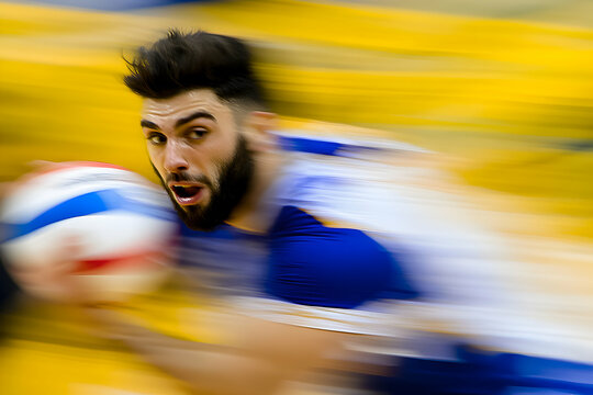 Dynamic action shot of a male volleyball player in motion, blurred background emphasizing speed and intensity of the game.