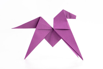 Little paper pony on white background. Origami animal. Paper crafts.