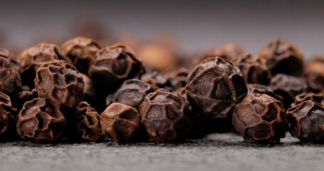 Peppercorns or black pepper spice. Super Macro Close Up.