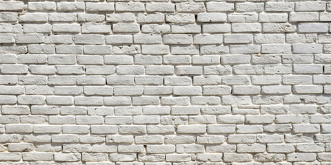 Obraz premium This clean white brick wall features a uniform texture, perfect for creating a fresh aesthetic. The smooth surface and even layout make it ideal for backgrounds in photography or design projects