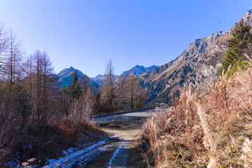 Mountain panorama in the Swiss Alps seen from mountain village of Maloja on a sunny autumn day. Photo taken November 15th, 2024, Maloja Bregaglia, Switzerland.