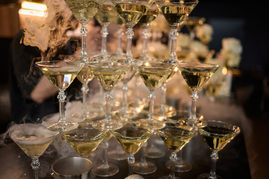 An elegant and stunning Champagne Tower adorned with a mysterious and enchanting smoke effect