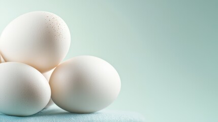 Fototapeta premium A group of white eggs sitting on top of a table