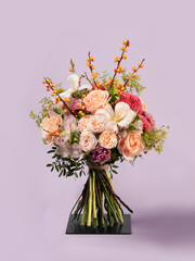 Elegant Floral Bouquet with Peach Roses and Sea Buckthorn Branches on Lilac Background