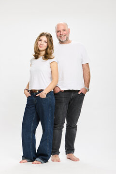 Studio portrait of father with teenager.